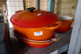 Le Creuset, four various orange cooking pots/dishes