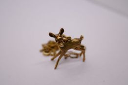 9ct yellow gold pendant in the form of a fawn, marked 375, on a rolled gold neckchain, 5.4g approx (