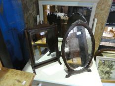 A Georgian mahogany toilet mirror and an oval easel mirror