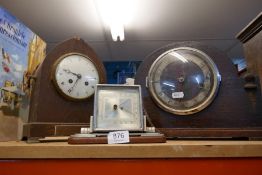 A pair of earl Edwardian wooden cased mantle clocks and a desk Barometer plus another