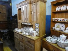 An old German pine dresser with porcelain drawers and cupboard back