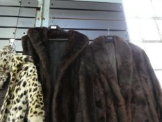 A 3/4 length mink fur coat and one other without arms and a similar jacket, no labels