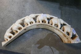 Bone carving of a number of elephants