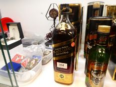 Johnnie Walker, a black label bottle of whisky, 1.125 litre, with box, and one other imported by Hon