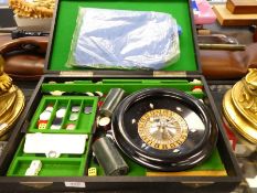 A vintage roulette game in fitted black Rexine case