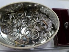 Collection of silver rings, brooches and a silver ring in a box