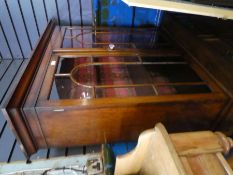 A late Victorian walnut cupboard having to drawers with associated mahogany glazed top