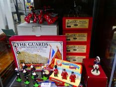 Shelf of Britains and other boxed toy soldiers and knights