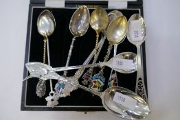 A quantity of silver and white metal collector's spoons, some Canadian, Danish, etc, of intricate an