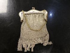 A white metal purse, European with fringe base and decorative detail. Total weight 1.25 ozt