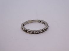 Platinum half eternity ring inset with 18 diamonds, marked PLAT, Size P