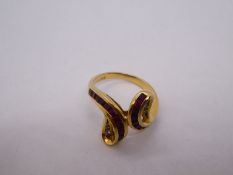 Middle Eastern 8ct gold dress ring, in the form of snakeheads, with chanel set rubies and graduated
