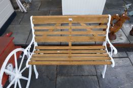 An old seed planter with replacement box and a garden bench