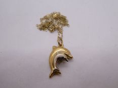 9ct yellow gold fine chain, hung with a dolphin pendant, 1.1g approx