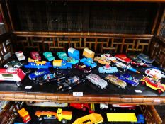 Shelf of playworn die-cast vehicles to include Corgi Batmobile, Basil Brush, James Bond