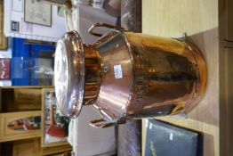 An old copper milk churn, the body stamped Home Counties Dairies