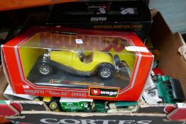 A selection of boxed model cars including matchbox and Burago etc