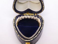 9ct yellow gold ring set with 7 diamonds, size S, approx 3g in tooled leather heart shaped box marke