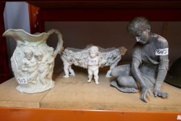 A set of  ceramics including Roman style decorated water jug and a spelter figure of a child etc (3)