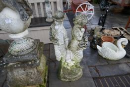 A reconstituted garden statue of 2 figures