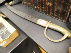 A 19th Century cutlass, having brass handle with leather scabbard