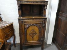 A reproduction ok court cupboard having one door, 70.5cm