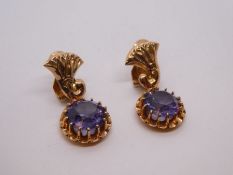 Pair of Middle Eastern rose gold clip on earrings each set with a circular, possibly Sapphire facete