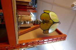 A brass base standard lamp with iridescent style panel lampshade