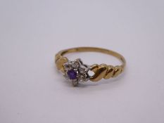 Pretty 9ct yellow gold cluster ring set with purple and clear stones, size R, 1.6g approx