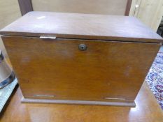 An antique oak stationery cabinet with desk slope and letter rack