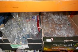 A set of cut glass drinking vessels, champagne flutes, decanters, etc