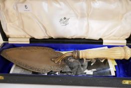 An interesting silver Victorian trowel of engraved border, and ivory handle. Carves with image, pape