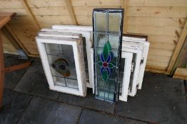 A quantity of small leaded glass windows and similar