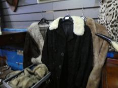 A 1970s style fur jacket and one other jacket and a double breasted black coat with fur collar