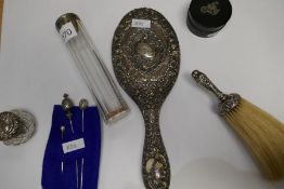 Silver dressing table items to include a silver hand mirror, brush, two lidded glass trinket pots an