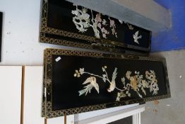 Four oriental carved pictures depicting birds cherry blossom, etc