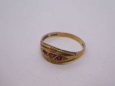 9ct yellow gold gypsy ring set with three small rubies, marked 375, size P, 1.7g approx