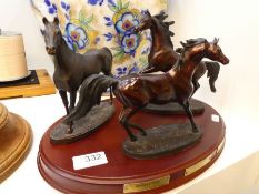 A set of 3 bronze horse sculptures by Franklin Mint, "The Origins of Champions" on oval base