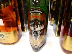 Glenfiddich, a 75cl bottle in black tube case, and a smaller example, 35cc