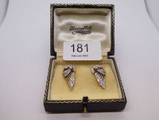 A pair of Edwardian white metal earrings in the form of angel wings, Studded with diamonds. approx 2