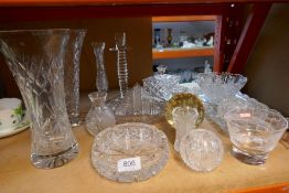 A selection of cut glass items including posy vases paper weight etc