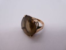 9ct rose gold ring set with a large Smokey Topaz, 2cm diameter marked 9ct, size L, 9.2g approx