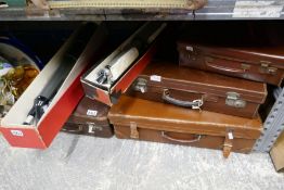 Three brown leather vintage cases, Lumex telescope and another and case of ephemera
