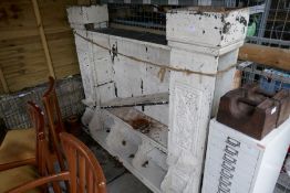 An early 20th century oak fireplace surround, having carved panels