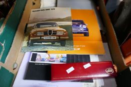A quantity of motoring ephemera including Saab, Mini, etc and a boxed Jaguar pen