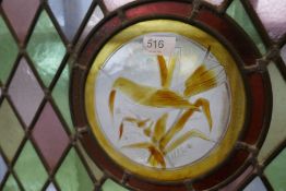 Two coloured leaded glass panels, the centres decorated birds and one other clear glass panel (3)