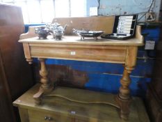 An old stripped pine washstand having gallery back