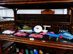 Shelf of unboxed Dinky TV and film vehicles, to include Thunderbirds, Star Trek, Space 1999