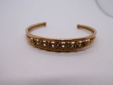 Antique 9ct yellow gold bangle inset with 7 multi colour gemstones, marked 375, 6cm diameter, 5g app