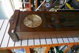 A 1920/30s longcase clock, with pendulum